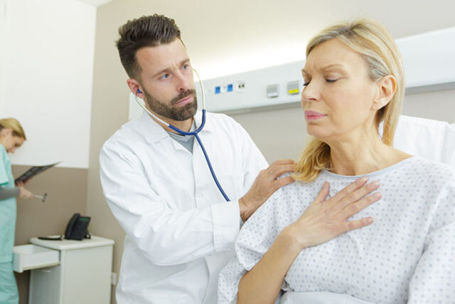 A doctor checks a patient for infective endocarditis